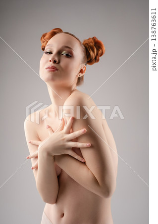 Studio beauty portrait of a confident woman in a sensual topless pose 138763611