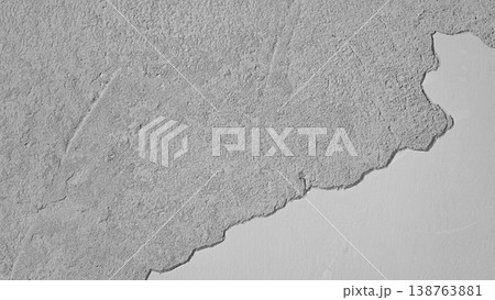 Grunge wall with peeling plaster on white background 138763881