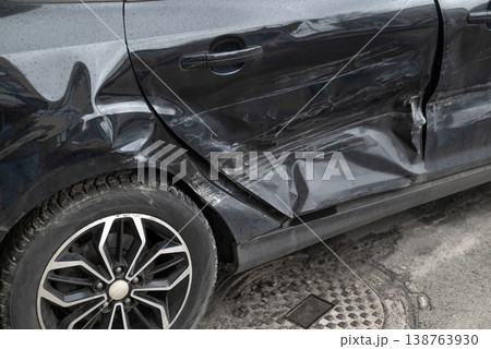 Damaged car door after collision with dents and scratches, auto accident and insurance claim concept Damaged car door after collision with dents and scratches, auto accident and insurance claim concept 138763930