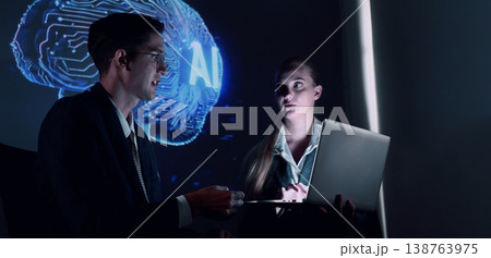 Ai and Business. Team collaborating with futuristic AI workspace illuminated by digital brain and neural network visuals. Ideal for artificial intelligence innovation teamwork and technology concepts 138763975