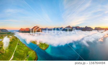 Aerial drone view of sunset over Lofoten mountains and fjords in Norway.  138764494