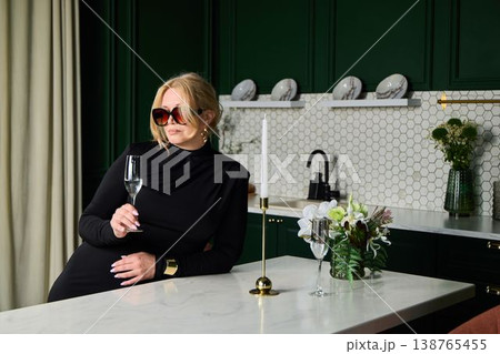 Interior designer caucasian woman planning over marble island Interior designer caucasian woman planning over marble island 138765455