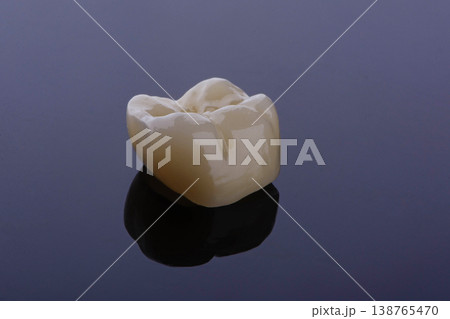 High-quality zirconia dental crown on white background. Dental ceramic crown professional dental lab High-quality zirconia dental crown on white background. Dental ceramic crown professional dental lab 138765470