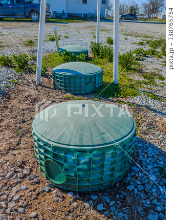 Septic covers over a biological leach system in a small town  138765784