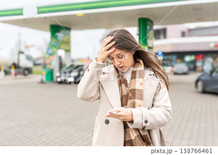 Fuel inflation concept woman shocked by gas receipt 138766461