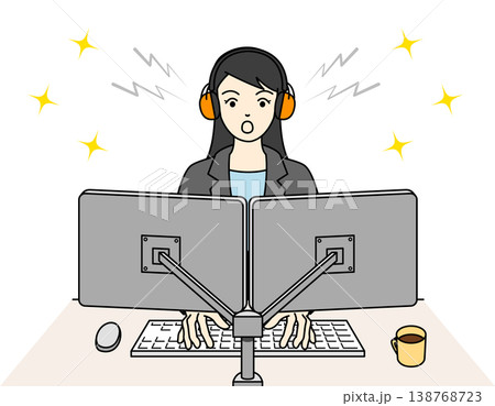 イヤーマフを装着してPC作業に集中する女性 138768723