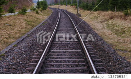 Silent Railway Route Flows Into Distant Peaceful Landscape With Greenery Silent Railway Route Flows Into Distant Peaceful Landscape With Greenery 138769524