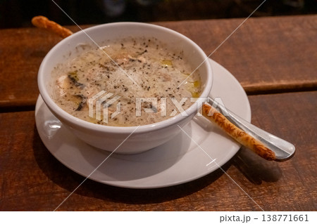 Mushroom soup served in a bowl in the restaurant 138771661