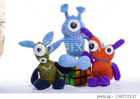 Knitted wool aliens on a white background 138772517