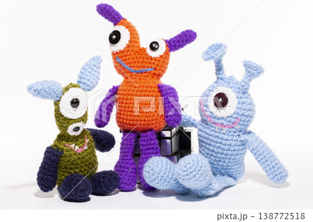 Knitted wool aliens on a white background 138772518