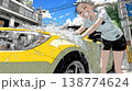 晴れた日に洗車をする若い女性｜青空と水しぶきの爽やかなライフスタイルシーン 138774624