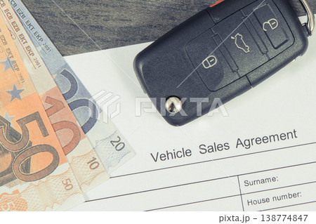 Car key, euro banknotes and vehicle sales agreement. Sales or purchases new or used vehicle 138774847