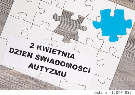 White and blue puzzle. Polish inscription 2 April Autism Awareness Day White and blue puzzle. Polish inscription 2 April Autism Awareness Day 138774855
