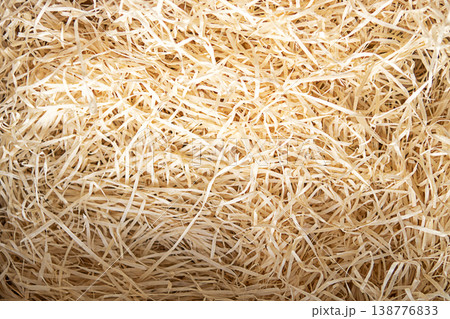Natural wood wool packing filler and shredded paper straw texture for gift packaging Natural wood wool packing filler and shredded paper straw texture for gift packaging 138776833