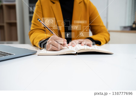 Learning online working concept. Businesswoman working on tablet and laptop computer, searching working in office. Learning online working concept. Businesswoman working on tablet and laptop computer, searching working in office. 138777696