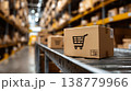 Cardboard shipping box with shopping cart icon in warehouse storage aisle logistics ecommerce delivery distribution concept 138779966