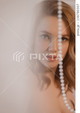 Woman With Jewelry. Intimate Shot Of Lady Showcasing Beauty With Gentle Gaze And Glossy Lips 138780307