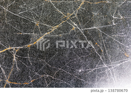 Goldenveined dark marble surface. Polished black marble featuring gold streaks and sparkle Goldenveined dark marble surface. Polished black marble featuring gold streaks and sparkle 138780670