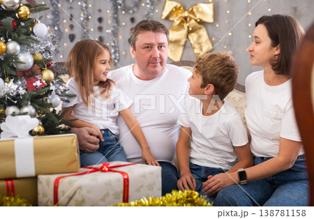 Family with children on sofa in christmas interior Family with children on sofa in christmas interior 138781158