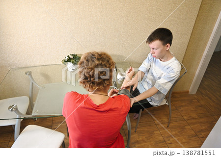 Boy listening to grandfather's heartbeat with stethoscope Boy listening to grandfather's heartbeat with stethoscope 138781551
