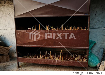 Metal candle stand with burning prayer candles at Ribnica Monastery near Mionica Serbia. Religious ritual scene representing faith spirituality prayer pilgrimage and sacred tradition 138782021