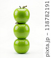 Geometric Stack of Three Different Green Apples with Stems Isolated on a Solid White Background 138782191