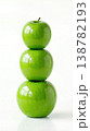 Geometric Stack of Three Different Green Apples with Stems Isolated on a Solid White Background 138782193