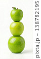 Geometric Stack of Three Different Green Apples with Stems Isolated on a Solid White Background 138782195