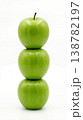 Geometric Stack of Three Different Green Apples with Stems Isolated on a Solid White Background 138782197