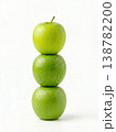 Geometric Stack of Three Different Green Apples with Stems Isolated on a Solid White Background 138782200