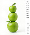 Geometric Stack of Three Different Green Apples with Stems Isolated on a Solid White Background 138782204