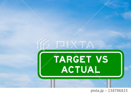 Green color transportation sign with word target vs actual on blue sky with white cloud background 138786815