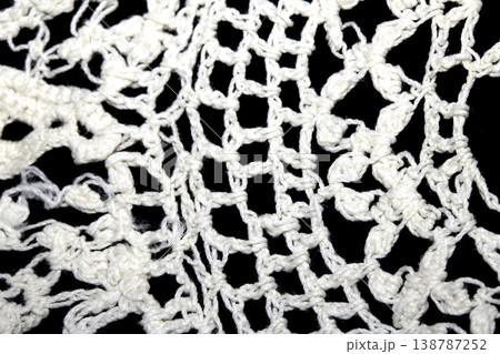 Close up of vintage lace fabric white on black background embroidery 138787252