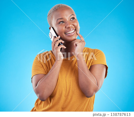 Happy woman, phone call and thinking of university decision, listening to news and feedback on a blue, studio background. African person or student on mobile communication, ideas and future planning 138787613