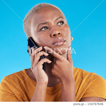 Black woman, phone call and thinking of college decision, listening to news or feedback on blue, studio background. Serious person or student on mobile communication with doubt, choice or idea emoji Black woman, phone call and thinking of college decision, listening to news or feedback on blue, studio background. Serious person or student on mobile communication with doubt, choice or idea emoji 138787646