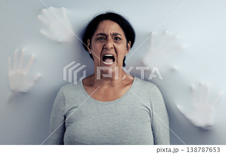 Portrait, screaming and senior woman with stress, depression and frustrated with mental health or fear. Angry face, female person and model with anxiety, horror and psychology on a studio background Portrait, screaming and senior woman with stress, depression and frustrated with mental health or fear. Angry face, female person and model with anxiety, horror and psychology on a studio background 138787653