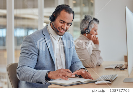 Writing, call centre and a man consulting for customer service, crm or telemarketing. A happy person or agent with a headset for networking, help desk advice or sales and technical support in office 138787703
