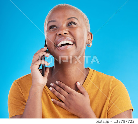 Phone call, good news or happy black woman in studio on blue background talking for communication. Mobile, face or African girl listening or calling to chat in conversation or speaking of funny joke Phone call, good news or happy black woman in studio on blue background talking for communication. Mobile, face or African girl listening or calling to chat in conversation or speaking of funny joke 138787722