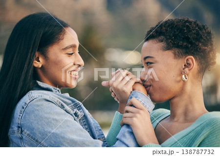 Kiss on hand, gay couple or women friends outdoor with happiness, love and pride on summer travel. LGBTQ or lesbian people on holiday for freedom, romantic date or commitment to happy African partner Kiss on hand, gay couple or women friends outdoor with happiness, love and pride on summer travel. LGBTQ or lesbian people on holiday for freedom, romantic date or commitment to happy African partner 138787732