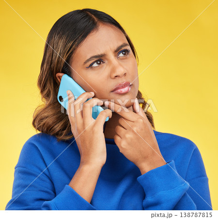 Phone call, thinking and woman confused, doubt and communication on a yellow studio background. Person, network and model with a smartphone, connection and spam problem with scam and conversation Phone call, thinking and woman confused, doubt and communication on a yellow studio background. Person, network and model with a smartphone, connection and spam problem with scam and conversation 138787815