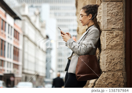 City wall, phone and business woman typing online research, reading email and scroll on website, app or social media. Urban sidewalk, cellphone and professional person relax on outdoor work break City wall, phone and business woman typing online research, reading email and scroll on website, app or social media. Urban sidewalk, cellphone and professional person relax on outdoor work break 138787984