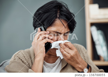 Phone call, sick and woman blowing her nose for the flu, cold or sinus allergies at her home. Illness, telehealth and senior female person with tissue on a medical doctor consultation with cellphone. 138788055