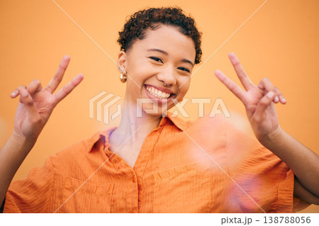 Peace, hands and happy woman in studio with thank you, gesture and self love against orange background space. freedom, face and female model with v emoji sign for good mood, confidence or positivity Peace, hands and happy woman in studio with thank you, gesture and self love against orange background space. freedom, face and female model with v emoji sign for good mood, confidence or positivity 138788056