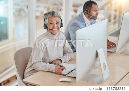 Computer, portrait and an elderly woman in a call center for customer service, support or assistance online. Contact, smile and happy senior consultant working at a desk in a professional crm office Computer, portrait and an elderly woman in a call center for customer service, support or assistance online. Contact, smile and happy senior consultant working at a desk in a professional crm office 138788213