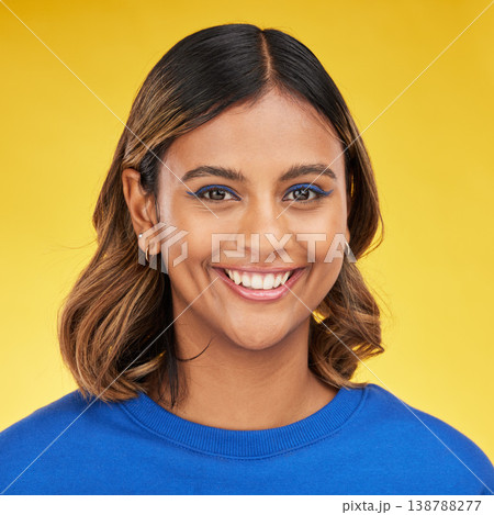 Portrait, smile and makeup with a woman on a yellow background in studio for fashion or cosmetics. Face, skincare and a happy young female model posing indoor in a trendy outfit for clothes style Portrait, smile and makeup with a woman on a yellow background in studio for fashion or cosmetics. Face, skincare and a happy young female model posing indoor in a trendy outfit for clothes style 138788277