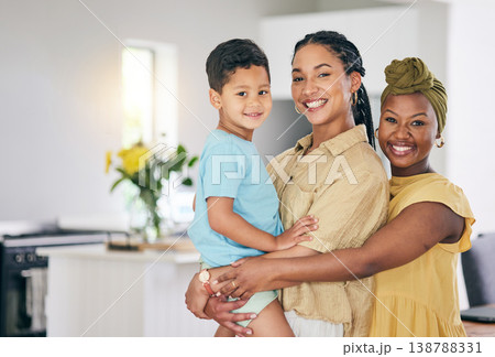 LGBT, kid and happy couple hug, portrait and smile for family solidarity, home support or enjoy quality time together. Love, hugging and gay people, mothers or lesbian women with adopted child in USA LGBT, kid and happy couple hug, portrait and smile for family solidarity, home support or enjoy quality time together. Love, hugging and gay people, mothers or lesbian women with adopted child in USA 138788331