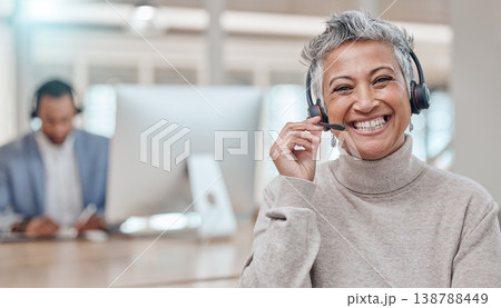 Call center, mature and face of woman with microphone in office for telemarketing, support or contact. Smile, portrait and customer service professional, sales manager or happy consultant listening Call center, mature and face of woman with microphone in office for telemarketing, support or contact. Smile, portrait and customer service professional, sales manager or happy consultant listening 138788449