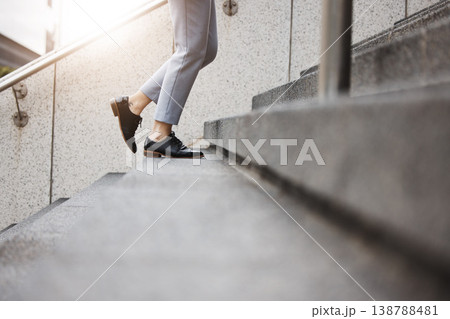 Stairs, morning person and legs walk, travel or on urban journey, outdoor commute or trip to work, destination or job. Town steps, arrival and closeup shoes, feet or agent climbing building staircase 138788481