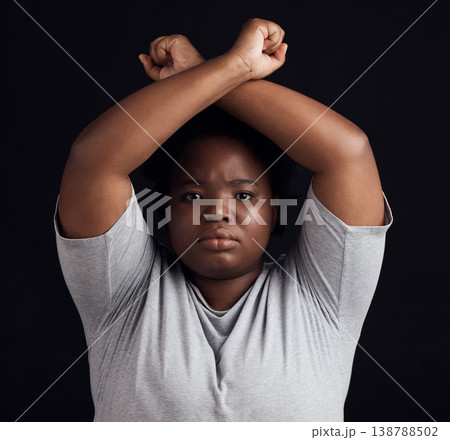 Portrait, human rights and a black woman in protest of domestic violence on a dark background. Freedom, equality or empowerment with a serious young female person in studio for gender discrimination 138788502