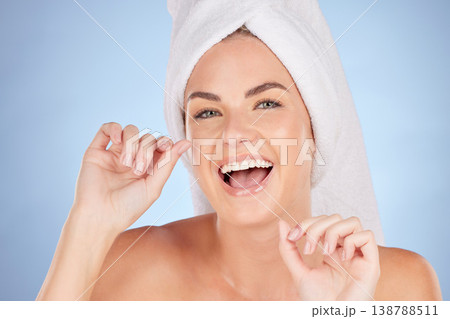 Dental floss, portrait or happy woman cleaning teeth for self care treatment, bathroom morning routine or tooth shine. Beauty, face or female model excited for mouth oral hygiene on studio background 138788511